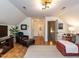Inviting bonus room with a comfortable seating arrangement, entertainment center, and convenient access to other areas at 800 Skymont Dr, Holly Springs, NC 27540