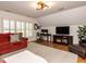 Versatile bonus room with wood floors, ample natural light, and a comfortable layout for work or relaxation at 800 Skymont Dr, Holly Springs, NC 27540