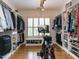 Spacious walk-in closet with custom shelving, hardwood floors, and a stationary bike for exercise at 800 Skymont Dr, Holly Springs, NC 27540