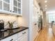 Close-up of kitchen details featuring a coffee station, stainless appliances, and ample storage space at 800 Skymont Dr, Holly Springs, NC 27540
