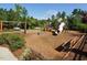 A fun community playground featuring swings, slides, and climbing structures, designed for active play and enjoyment at 800 Skymont Dr, Holly Springs, NC 27540