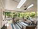 Bright screened-in porch with skylights and a table with seating overlooking the outdoor scenery at 800 Skymont Dr, Holly Springs, NC 27540