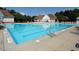 Large community swimming pool with clearly marked lanes and ample deck space for relaxation and recreation at 800 Skymont Dr, Holly Springs, NC 27540