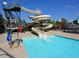 Exciting water slide at a community pool, offering a fun and refreshing experience for residents at 800 Skymont Dr, Holly Springs, NC 27540