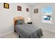 Cozy bedroom with neutral colors, a comfortable bed, and ample natural light for relaxation at 823 Biltmore Dr, Sanford, NC 27332