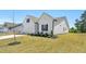 A well maintained home exterior featuring tidy landscaping, and a two-car garage at 823 Biltmore Dr, Sanford, NC 27332