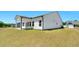 Exterior view of the home with a well-manicured lawn and covered patio at 823 Biltmore Dr, Sanford, NC 27332