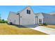 View of the side exterior and two-car garage with a concrete driveway at 823 Biltmore Dr, Sanford, NC 27332