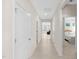 Bright hallway featuring light wood flooring and doors leading to other rooms at 823 Biltmore Dr, Sanford, NC 27332