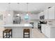 Modern kitchen with stainless steel appliances, white cabinets, and a kitchen island at 823 Biltmore Dr, Sanford, NC 27332