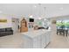 Spacious kitchen with white island open to the living and dining areas, creating an ideal gathering space at 823 Biltmore Dr, Sanford, NC 27332
