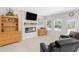 Comfortable living room with light floors, electric fireplace, and natural lighting at 823 Biltmore Dr, Sanford, NC 27332