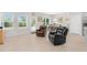 Open-concept living area featuring lots of natural light and hardwood floors at 823 Biltmore Dr, Sanford, NC 27332