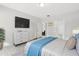 Tranquil main bedroom with a dresser, mounted TV, and ensuite bathroom access for added convenience at 823 Biltmore Dr, Sanford, NC 27332