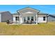 Charming outdoor patio with stylish seating and dining area at 823 Biltmore Dr, Sanford, NC 27332