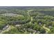 Aerial view featuring residential homes nestled in a lush, green environment at 900 Finchurch Cir, Wake Forest, NC 27587