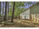 A spacious backyard featuring a wooden fence and an outdoor grill area at 900 Finchurch Cir, Wake Forest, NC 27587