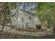 This home features an expansive backyard with a stone base and wooden deck at 900 Finchurch Cir, Wake Forest, NC 27587