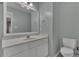 This bathroom features a vanity with a white countertop, and a toilet at 900 Finchurch Cir, Wake Forest, NC 27587