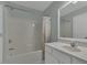 Bright bathroom features a tub-shower with a shower curtain and a single sink vanity at 900 Finchurch Cir, Wake Forest, NC 27587