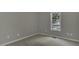 Bedroom featuring gray walls, gray carpet, and natural light at 900 Finchurch Cir, Wake Forest, NC 27587
