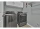 Updated laundry room features stainless steel washer and dryer at 900 Finchurch Cir, Wake Forest, NC 27587