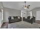 Comfortable living room with plush sofas, a ceiling fan, and a neutral color palette at 900 Finchurch Cir, Wake Forest, NC 27587