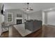 Inviting living room featuring a cozy fireplace, hardwood floors, and plenty of natural light at 900 Finchurch Cir, Wake Forest, NC 27587