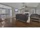 Spacious living room showcasing gleaming hardwood floors, a fireplace, and an open floor plan at 900 Finchurch Cir, Wake Forest, NC 27587