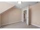 Finished attic with door and neutral walls, showcasing a versatile and inviting space at 97 Rand Rd, Raleigh, NC 27603