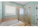 Bathroom featuring a glass enclosed shower and a soaking tub at 97 Rand Rd, Raleigh, NC 27603