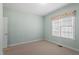 Bright bedroom featuring light blue walls and a window with a patterned valance, creating a serene space at 97 Rand Rd, Raleigh, NC 27603