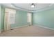 Spacious bedroom with carpet floors, and natural light from windows at 97 Rand Rd, Raleigh, NC 27603