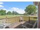 The open deck with chairs provides a relaxing space with views of the expansive backyard at 97 Rand Rd, Raleigh, NC 27603