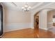 Elegant dining room with hardwood floors, wainscoting, and chandelier at 97 Rand Rd, Raleigh, NC 27603