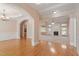 Spacious living room with hardwood floors and large arches into other rooms at 97 Rand Rd, Raleigh, NC 27603