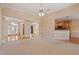 Open concept living room with hardwood floors and multiple arches connecting to the front entrance and kitchen at 97 Rand Rd, Raleigh, NC 27603