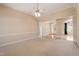 Open living room with neutral carpet and arches to other rooms in the home at 97 Rand Rd, Raleigh, NC 27603