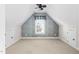 Finished attic bedroom with a window and neutral carpet at 9701 Precious Stone Dr, Wake Forest, NC 27587