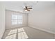 Bedroom with a window and neutral colored carpet at 9701 Precious Stone Dr, Wake Forest, NC 27587