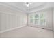 Bedroom featuring a tray ceiling, large window, and neutral carpet at 9701 Precious Stone Dr, Wake Forest, NC 27587