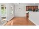 Open dining area next to kitchen has hardwood floors at 9701 Precious Stone Dr, Wake Forest, NC 27587