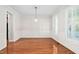 Elegant dining room boasts hardwood floors and decorative wainscoting at 9701 Precious Stone Dr, Wake Forest, NC 27587