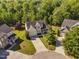 Charming two-story home with a manicured front yard and an attached two-car garage on a sunny day at 9701 Precious Stone Dr, Wake Forest, NC 27587