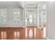 Bright foyer with hardwood floors, white trim, and a decorative front door, creating an inviting entrance at 9701 Precious Stone Dr, Wake Forest, NC 27587
