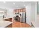 Bright kitchen with stainless steel appliances and breakfast bar at 9701 Precious Stone Dr, Wake Forest, NC 27587