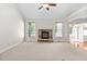 Spacious living room features a stone fireplace and large windows for natural light at 9701 Precious Stone Dr, Wake Forest, NC 27587