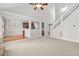 Open living room with high ceilings leads to the kitchen and stairs at 9701 Precious Stone Dr, Wake Forest, NC 27587
