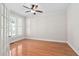 Home office featuring hardwood floors, ceiling fan, and natural light at 9701 Precious Stone Dr, Wake Forest, NC 27587