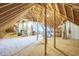 Unfinished attic space with exposed wooden beams, offering potential for customization and expansion at 1 Plowlan Ct, Durham, NC 27707